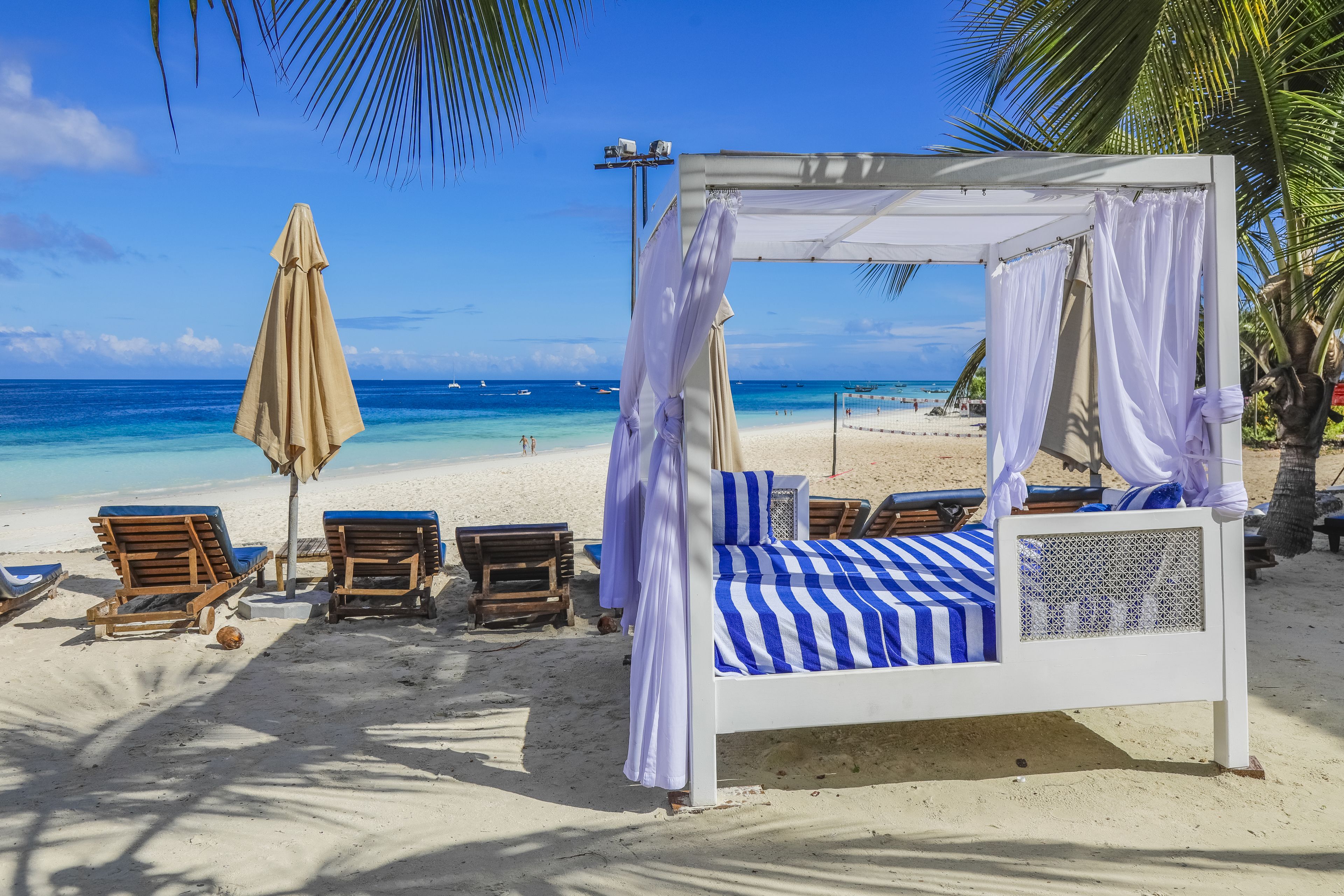 Private beach, white sand, sun loungers, beach umbrellas