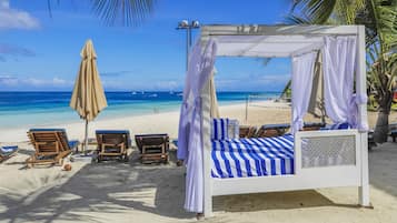 Private beach, white sand, sun loungers, beach umbrellas