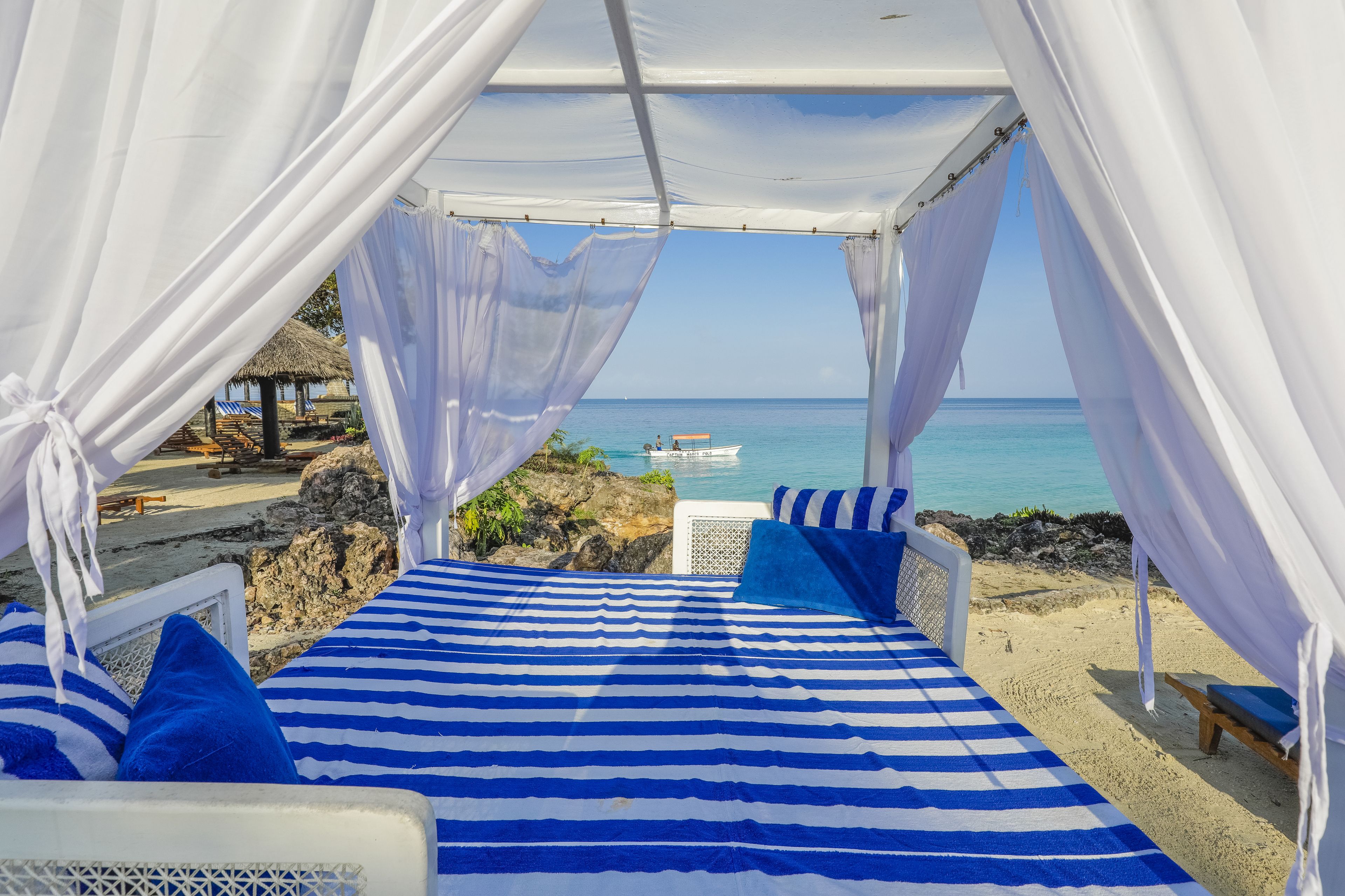 Private beach, white sand, sun loungers, beach umbrellas