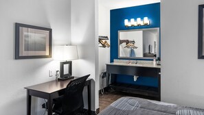 Desk, laptop workspace, blackout drapes, iron/ironing board
