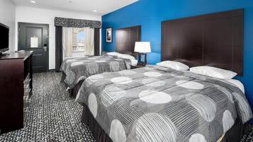 Desk, laptop workspace, blackout drapes, iron/ironing board