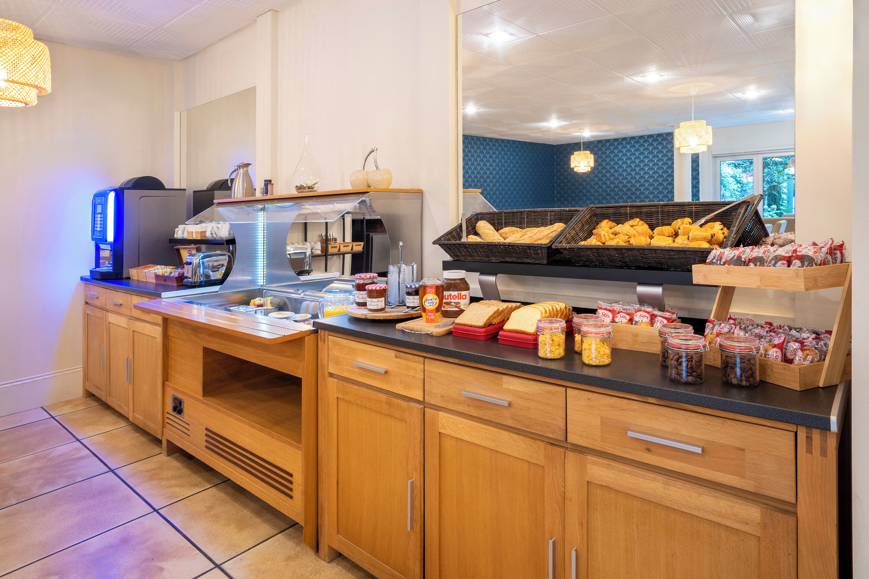 A breakfast buffet with various food items and a coffee machine.