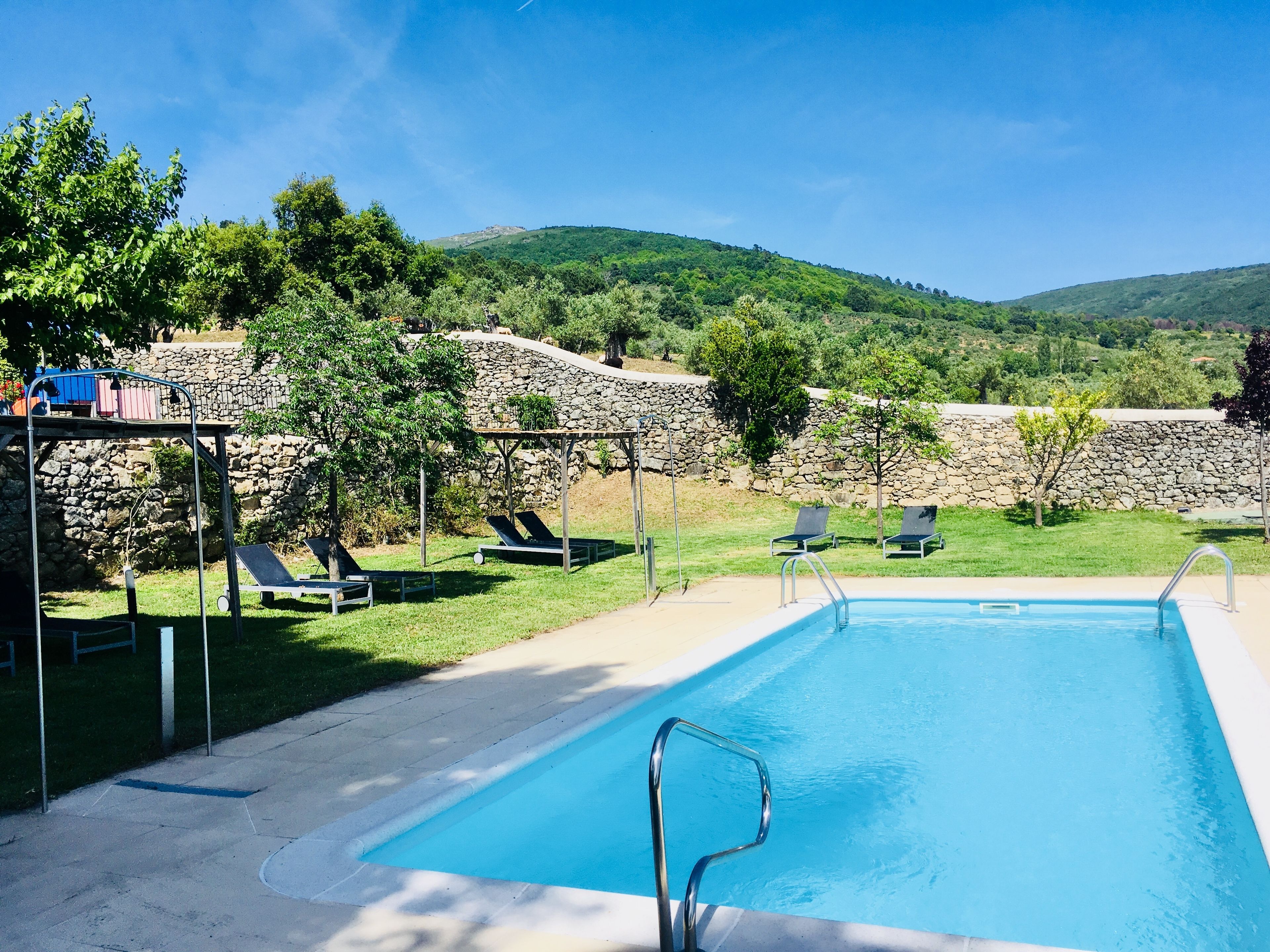 seasonal outdoor pool, open 11 am to 8:00 pm, pool umbrellas