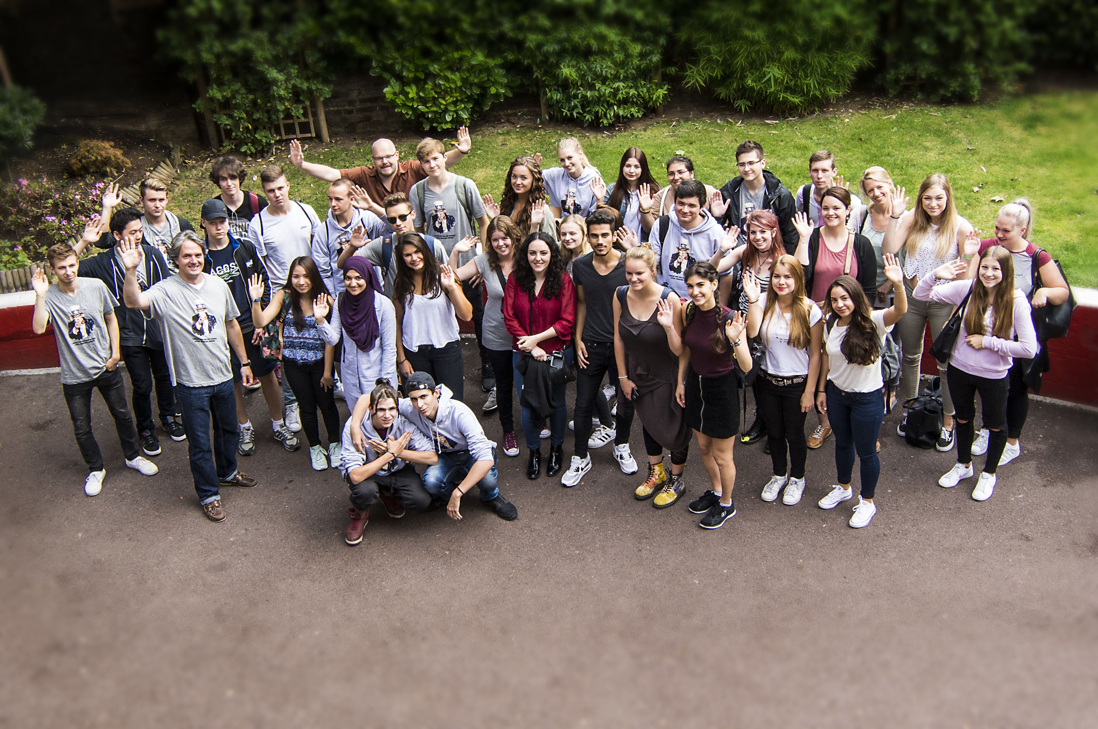A group of people posing for a photo outdoors.
