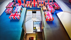 A staircase leading to a room with a view of the street. - Rest Up London - Hostel (London)