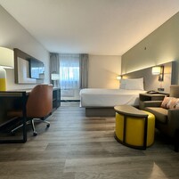 Standard Single Room, 1 Queen Bed | Pillowtop beds, blackout drapes, iron/ironing board, free WiFi