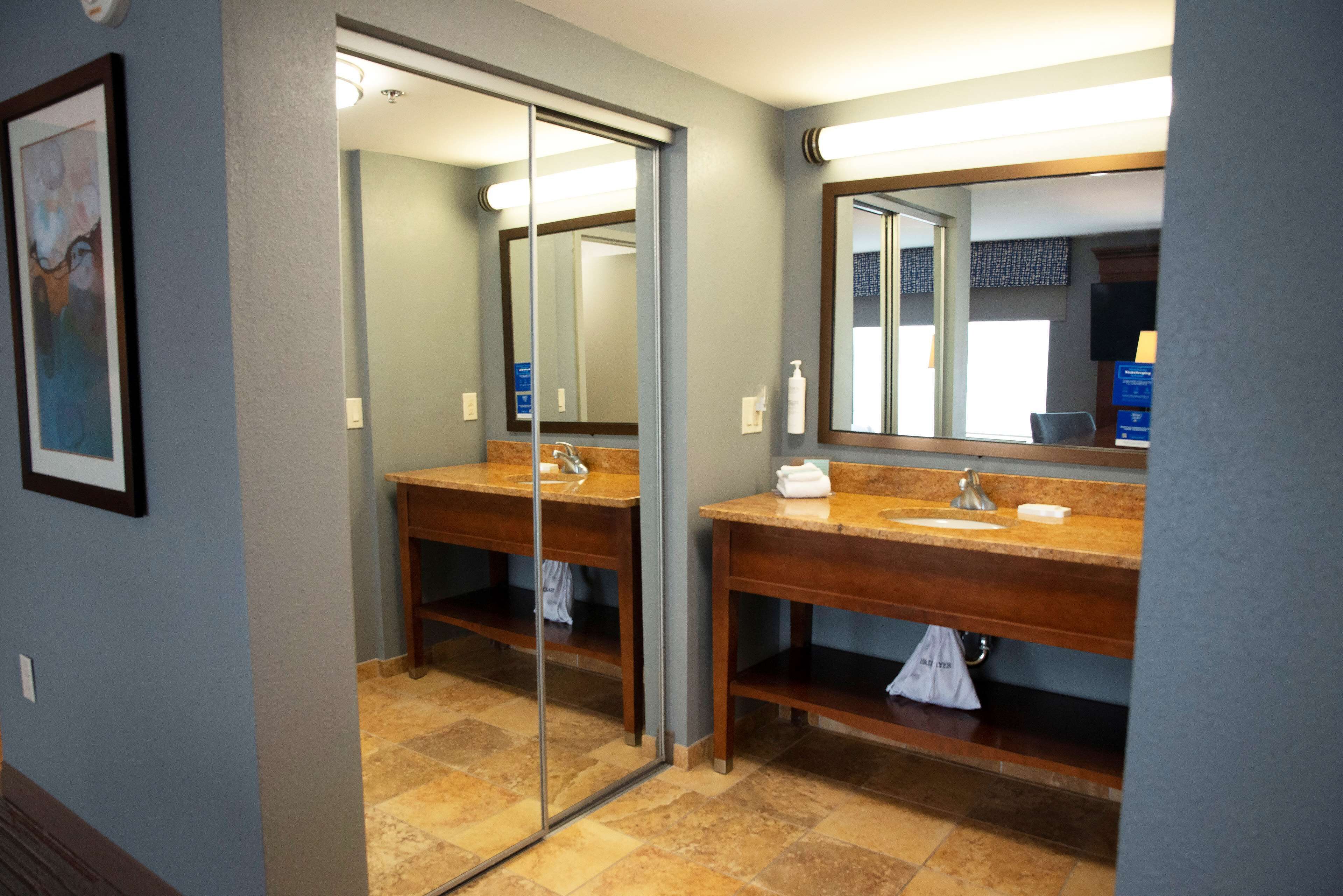 designer toiletries, hair dryer, towels