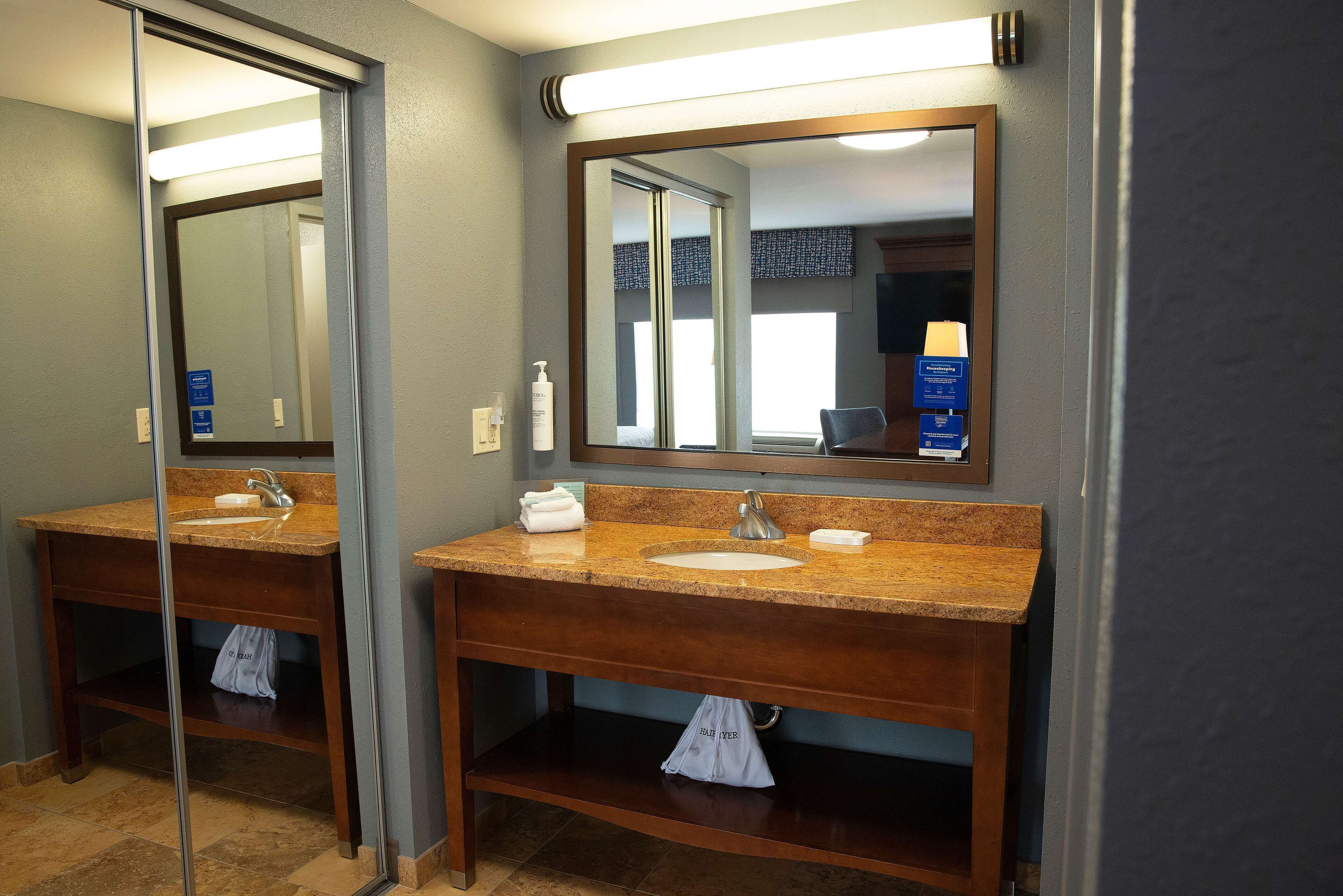 designer toiletries, hair dryer, towels