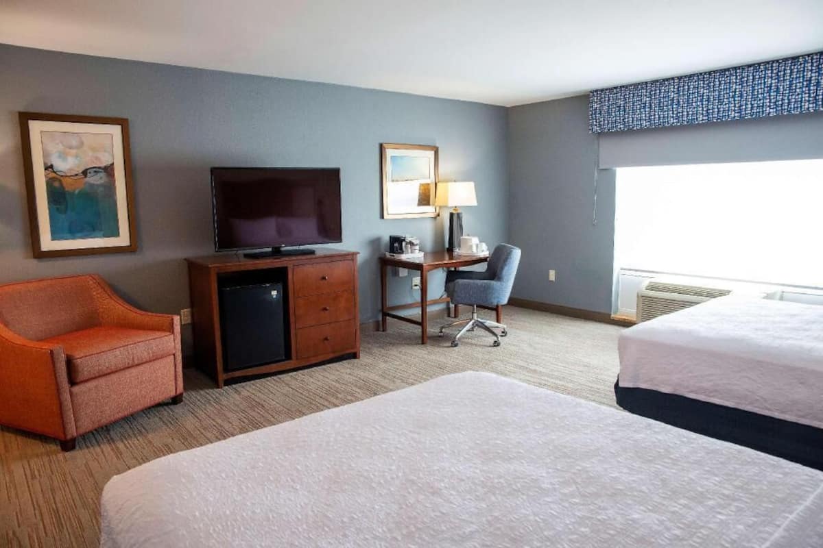 Desk, laptop workspace, blackout drapes, iron/ironing board