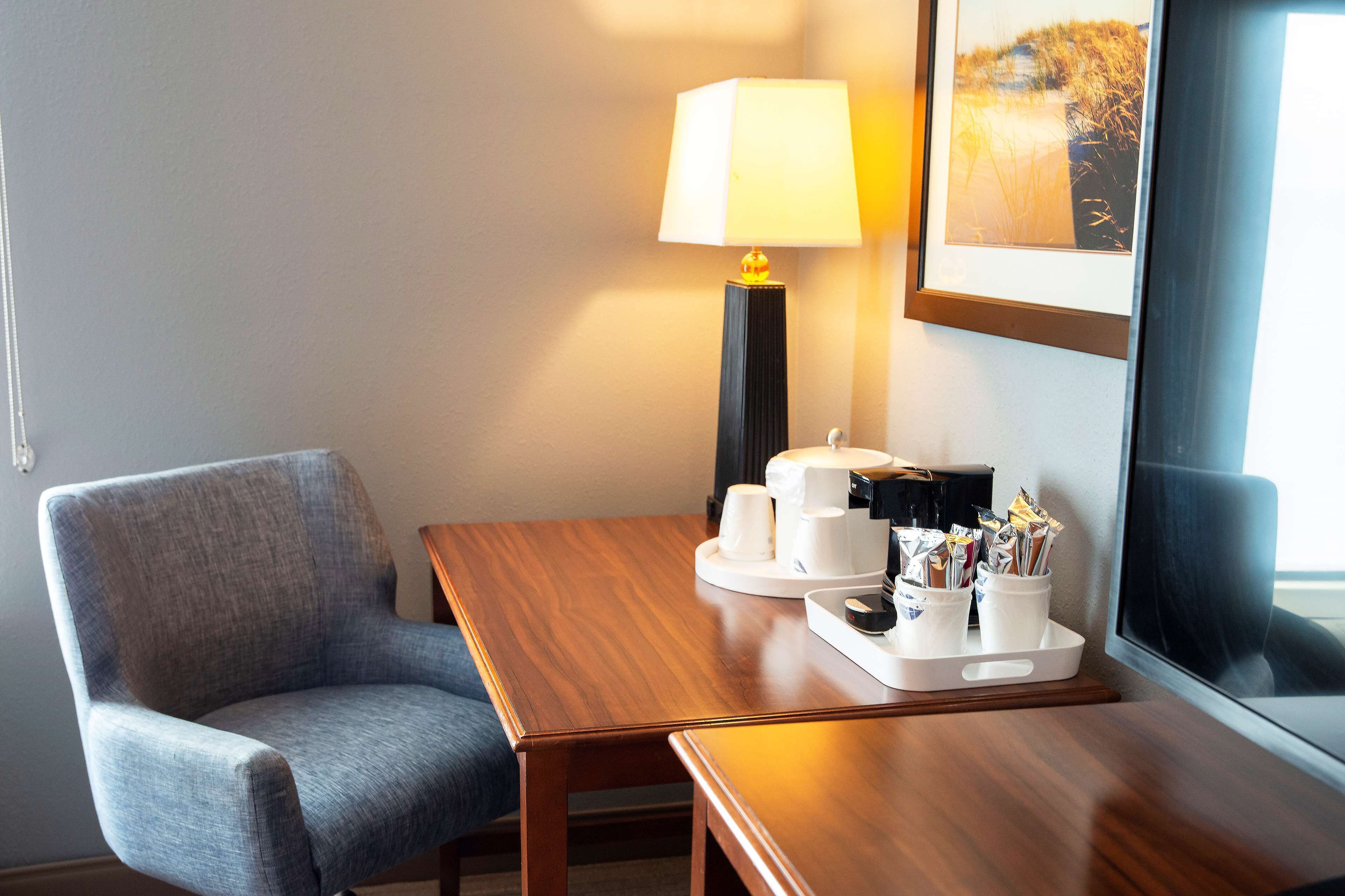 desk, laptop workspace, blackout curtains, iron/ironing board