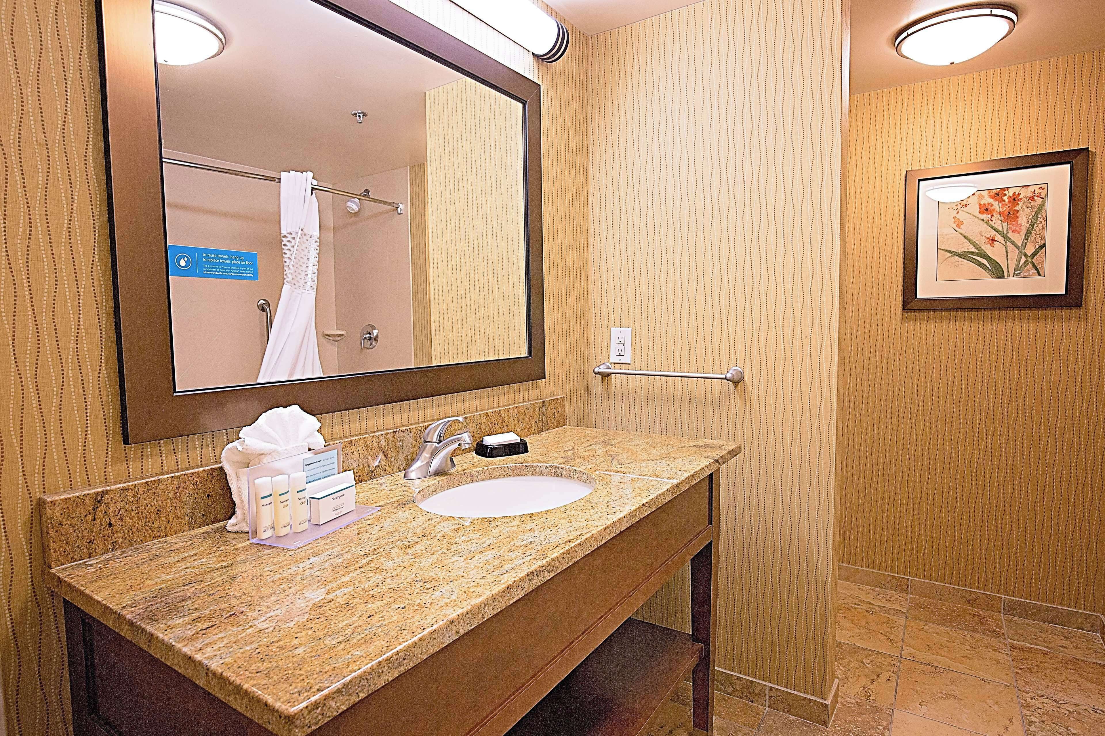 Designer toiletries, hair dryer, towels