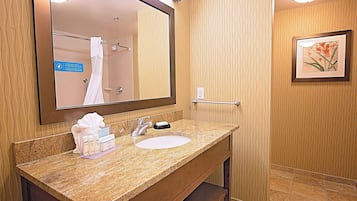 Designer toiletries, hair dryer, towels