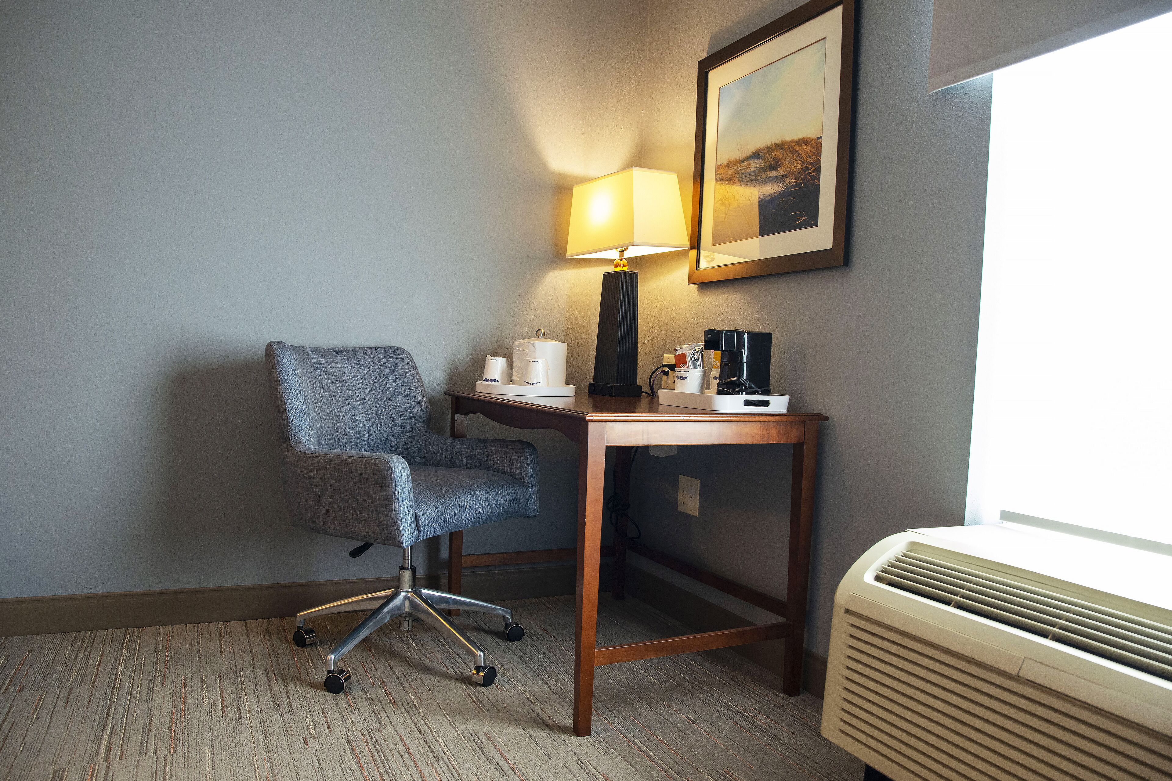 desk, laptop workspace, blackout curtains, iron/ironing board