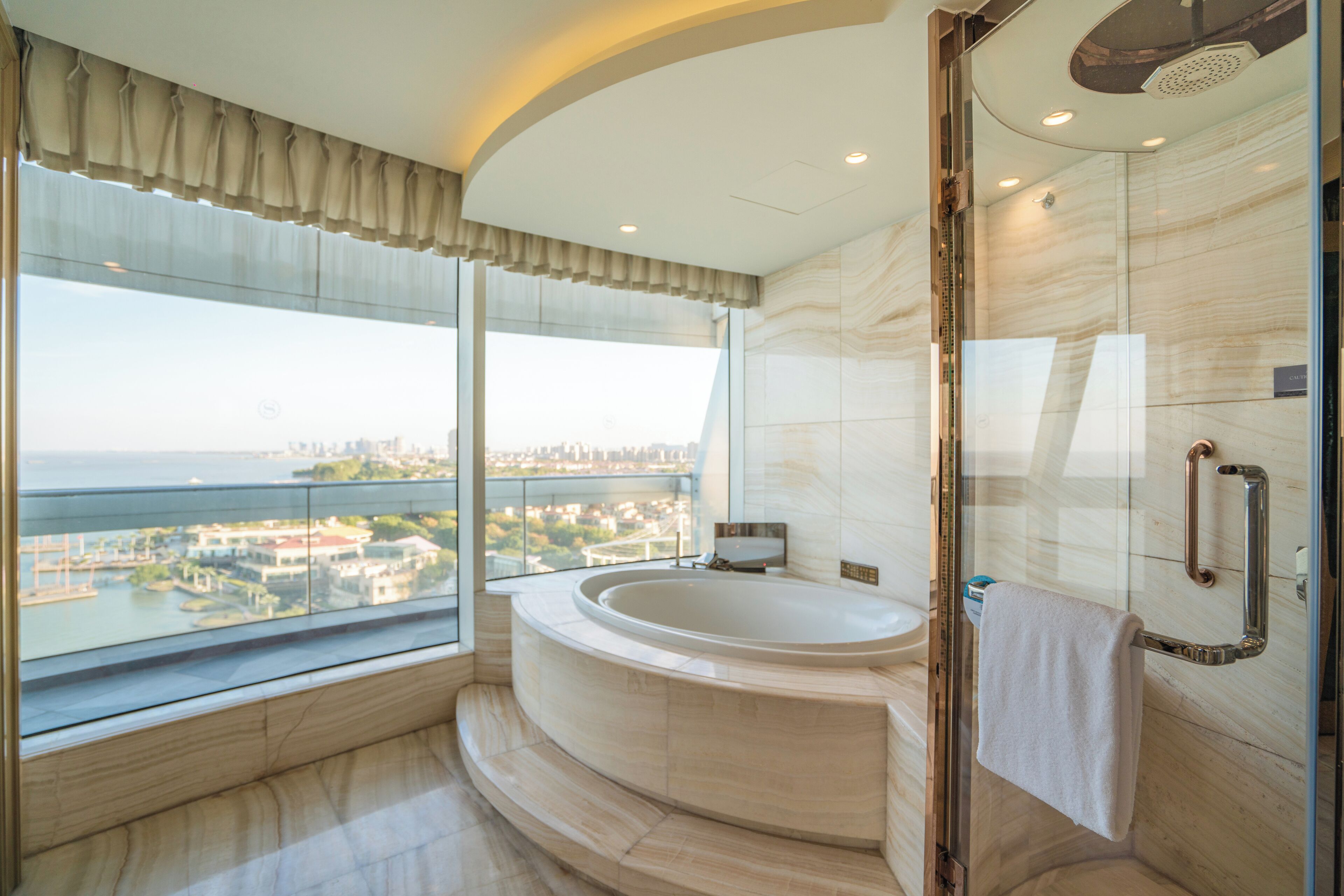 family room | bathroom | separate bathtub and shower, rainfall showerhead, designer toiletries