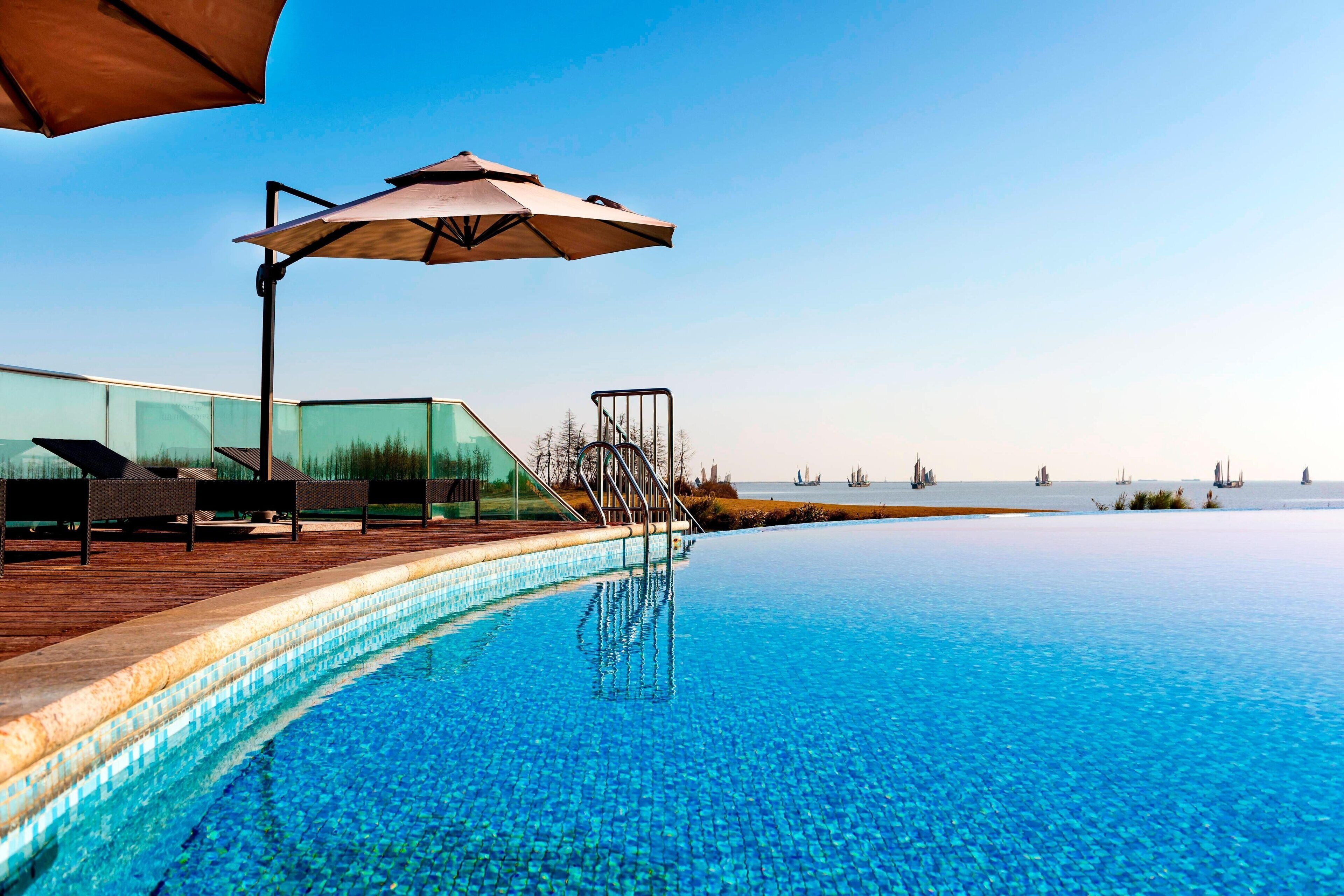 Indoor pool, outdoor pool, pool umbrellas