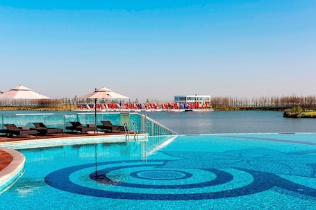 Indoor pool, outdoor pool, pool umbrellas