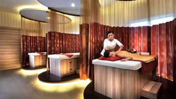 Relax in a serene space with two massage tables and soothing ambiance.