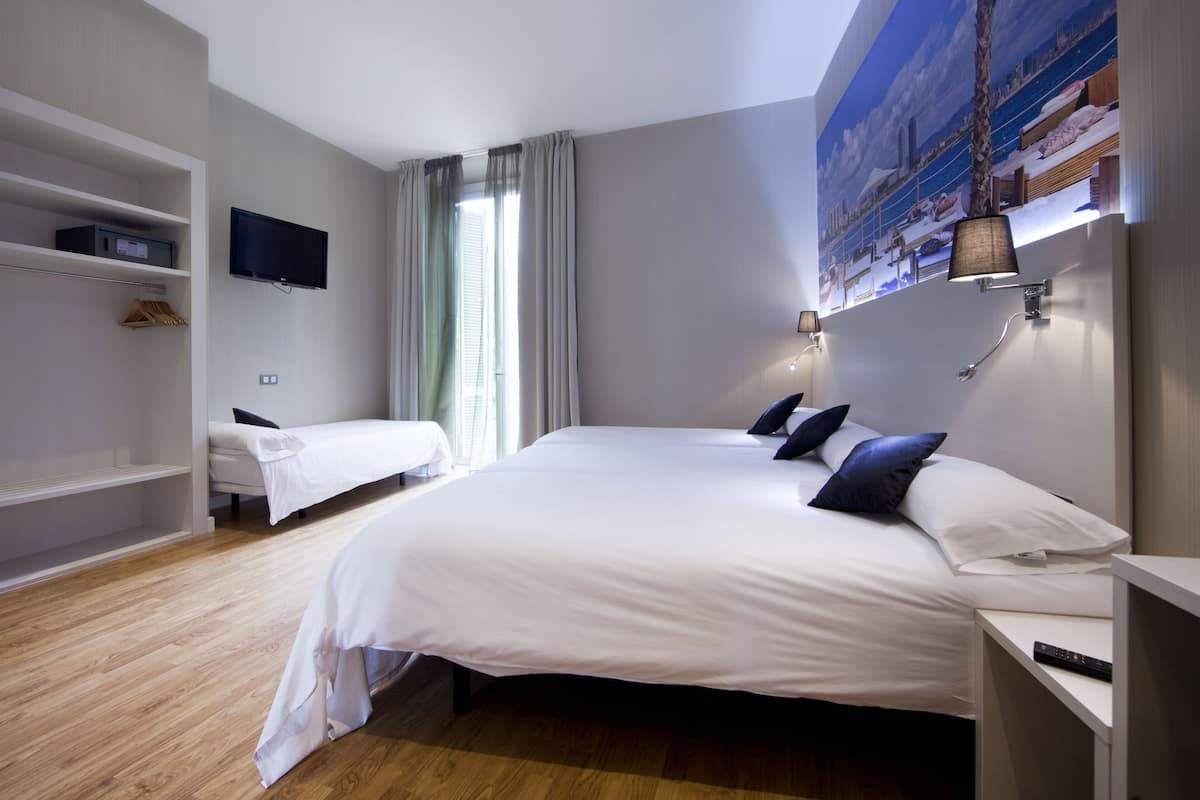 Quadruple Room, Balcony | In-room safe, individually furnished, desk, blackout drapes