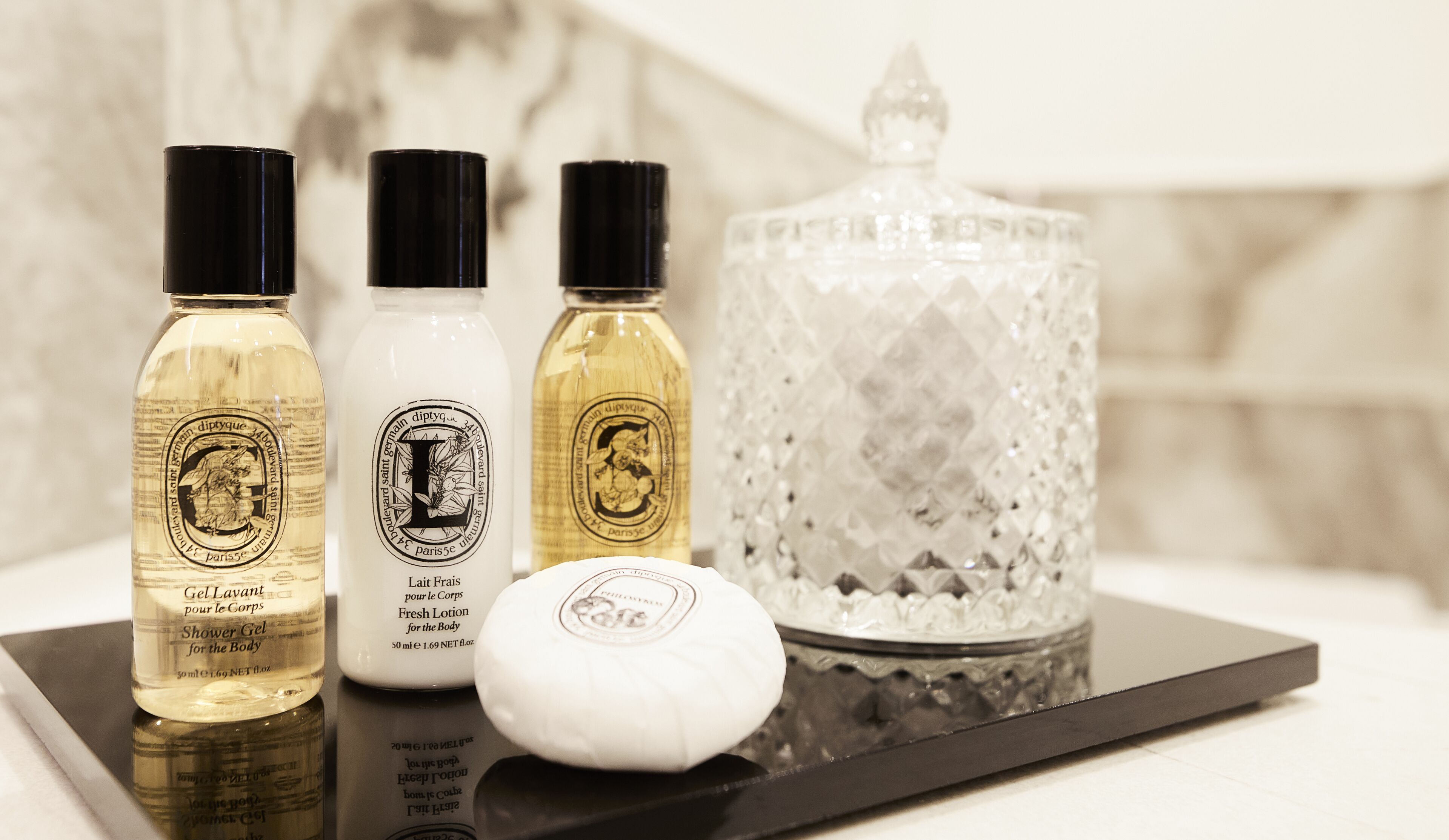 designer toiletries, hair dryer, bathrobes, slippers