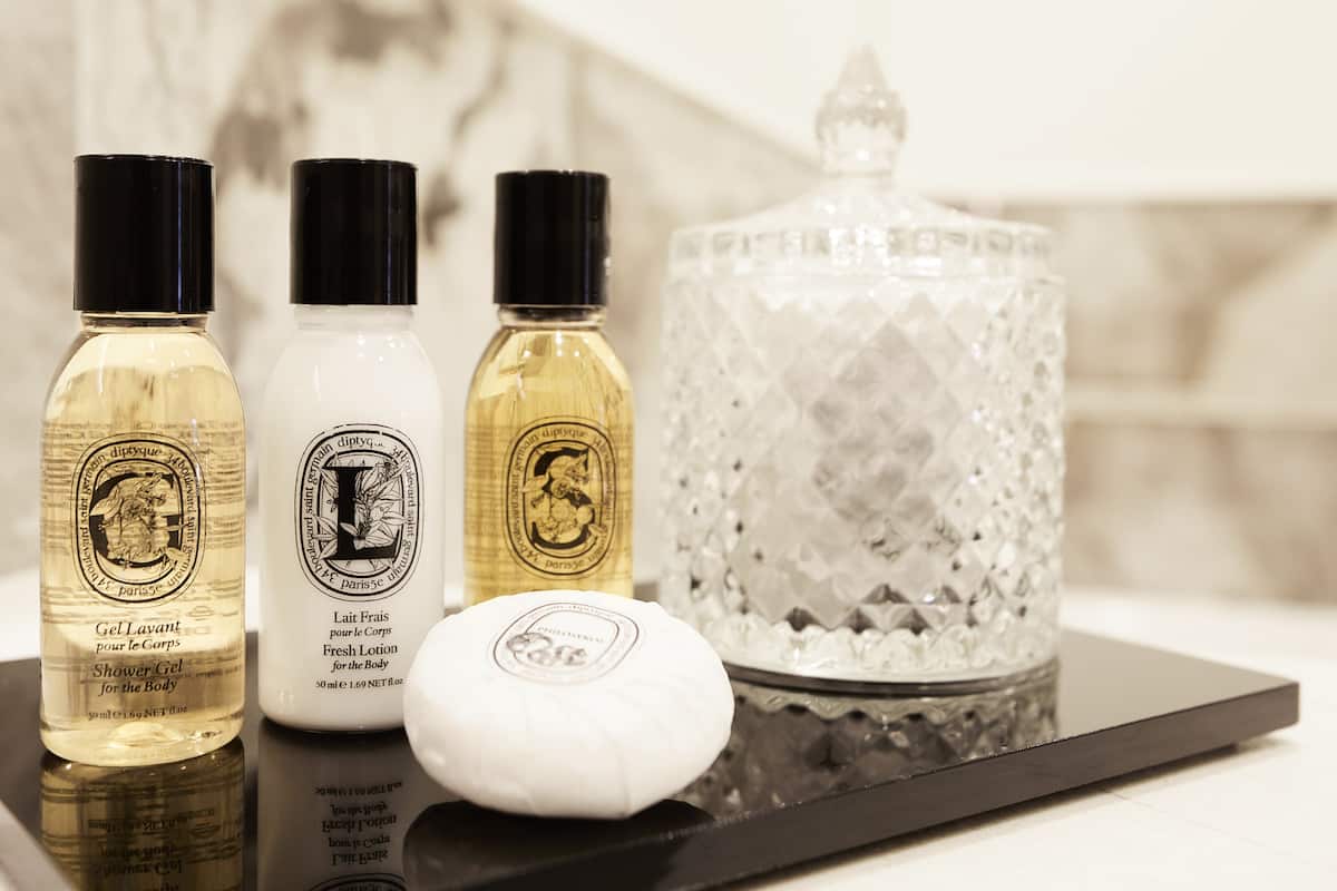 designer toiletries, hair dryer, bathrobes, slippers