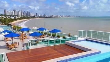 Outdoor pool, pool umbrellas, sun loungers