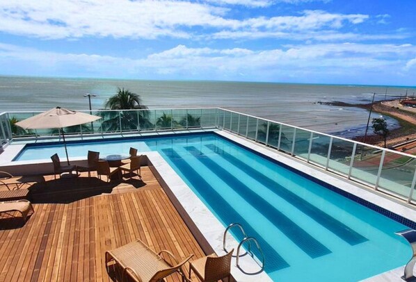 Outdoor pool, pool umbrellas, sun loungers