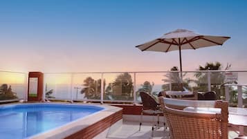 Outdoor pool, open 7 AM to 10 PM, pool umbrellas, pool loungers