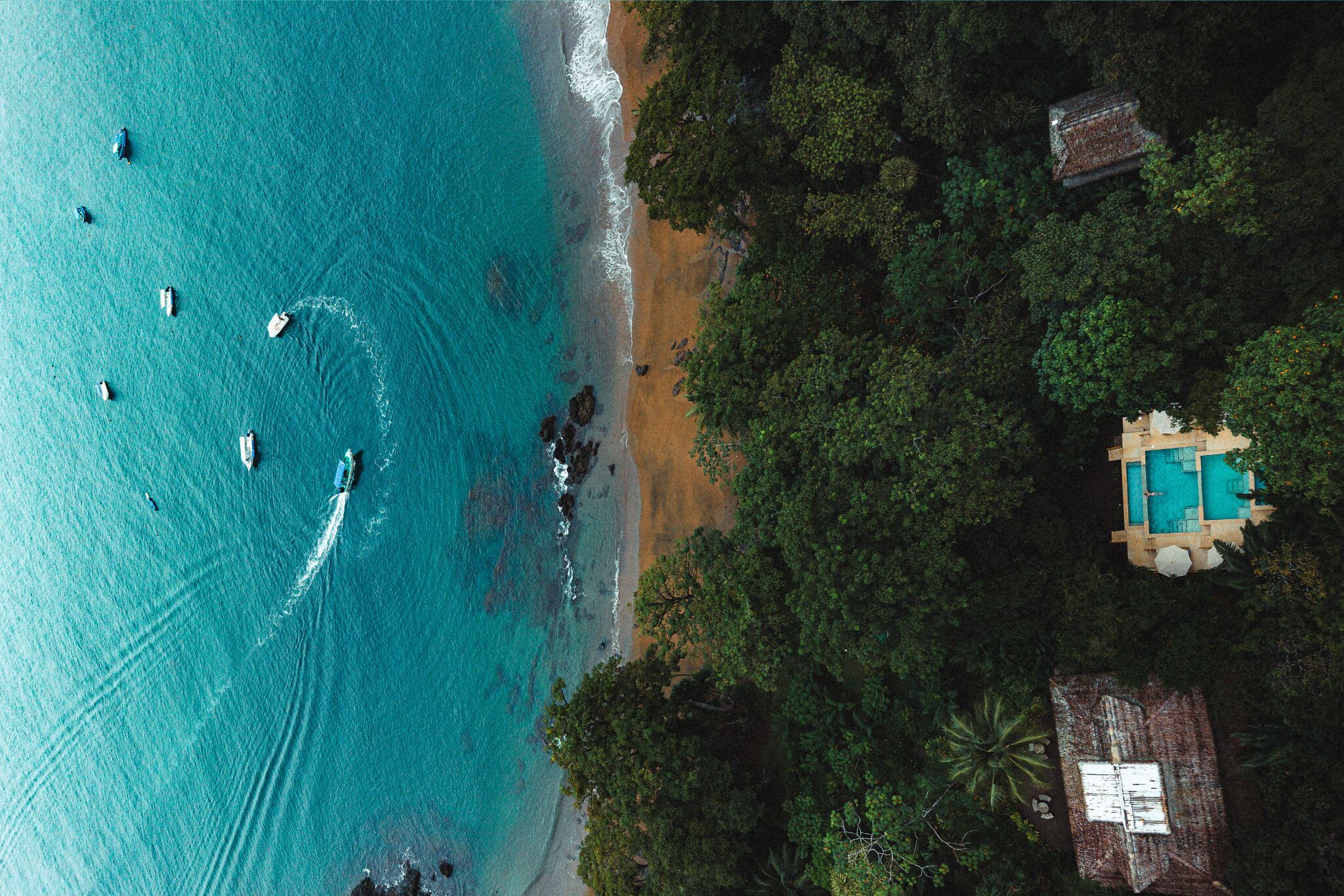 Outdoor pool, an infinity pool, pool umbrellas, pool loungers