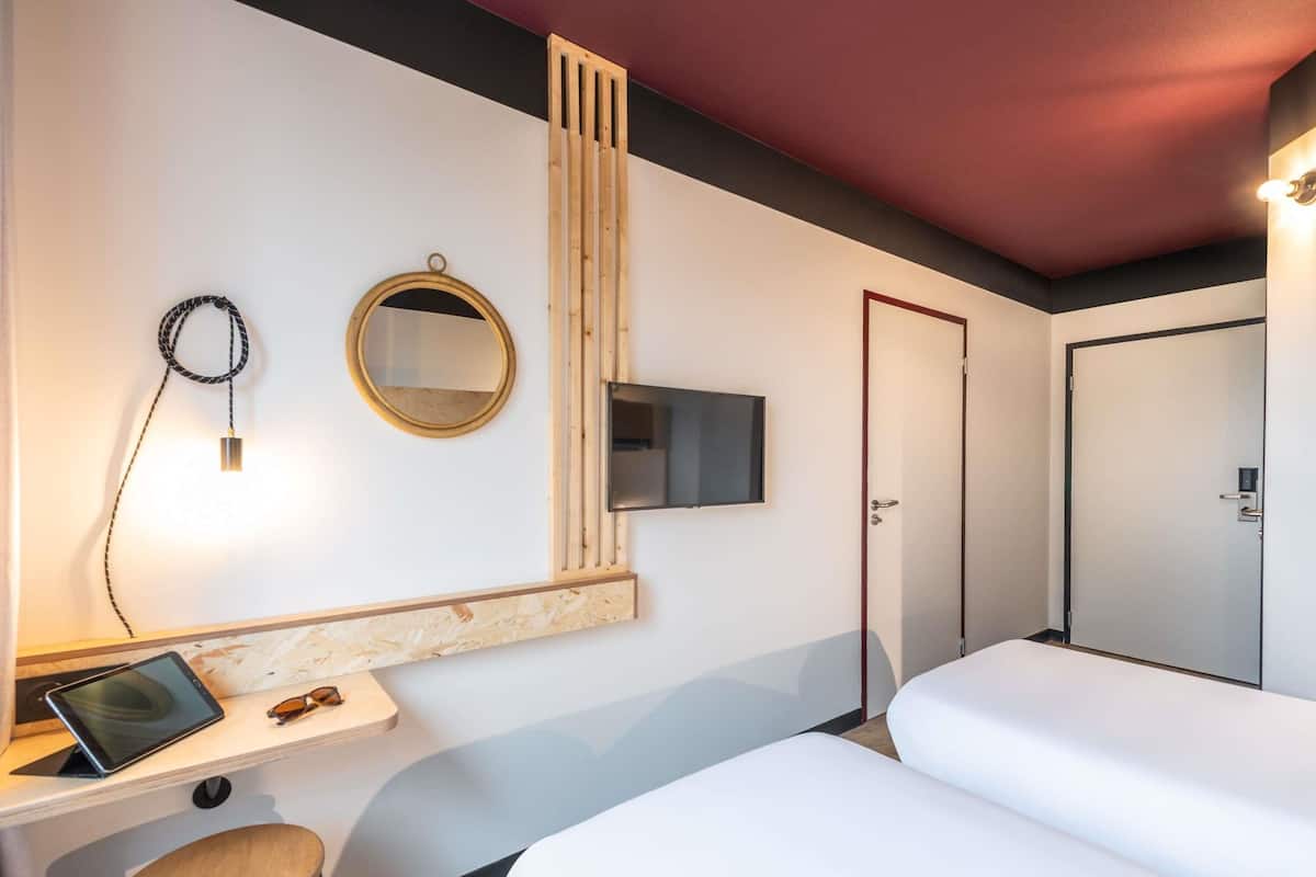 Premium bedding, desk, laptop workspace, soundproofing