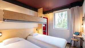 A hotel room with two beds, a desk, a window with curtains, and a red cabinet. - Greet Hotel Bourg-en-Bresse Sud Montagnat (Montagnat)
