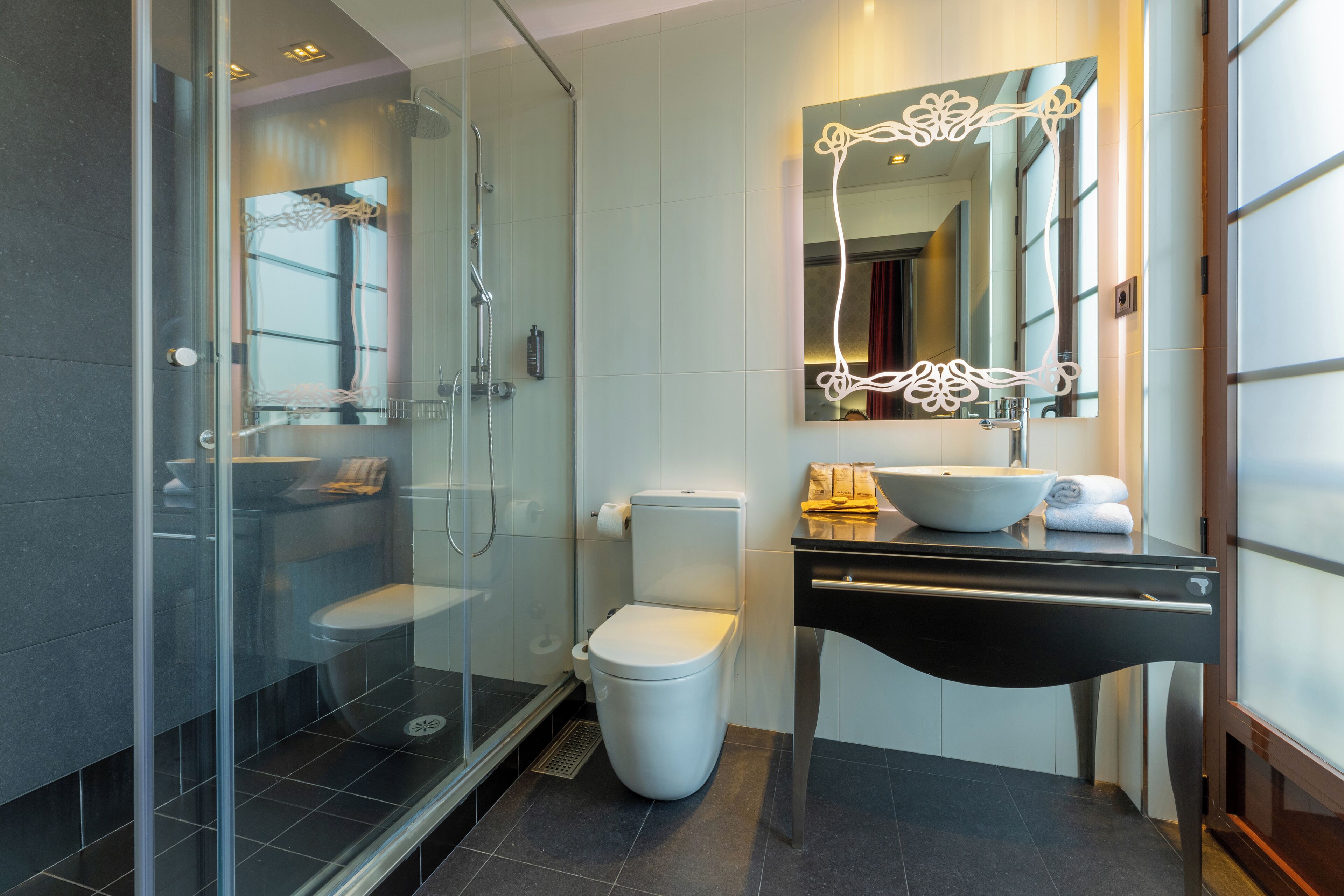 rainfall showerhead, eco-friendly toiletries, hair dryer, towels