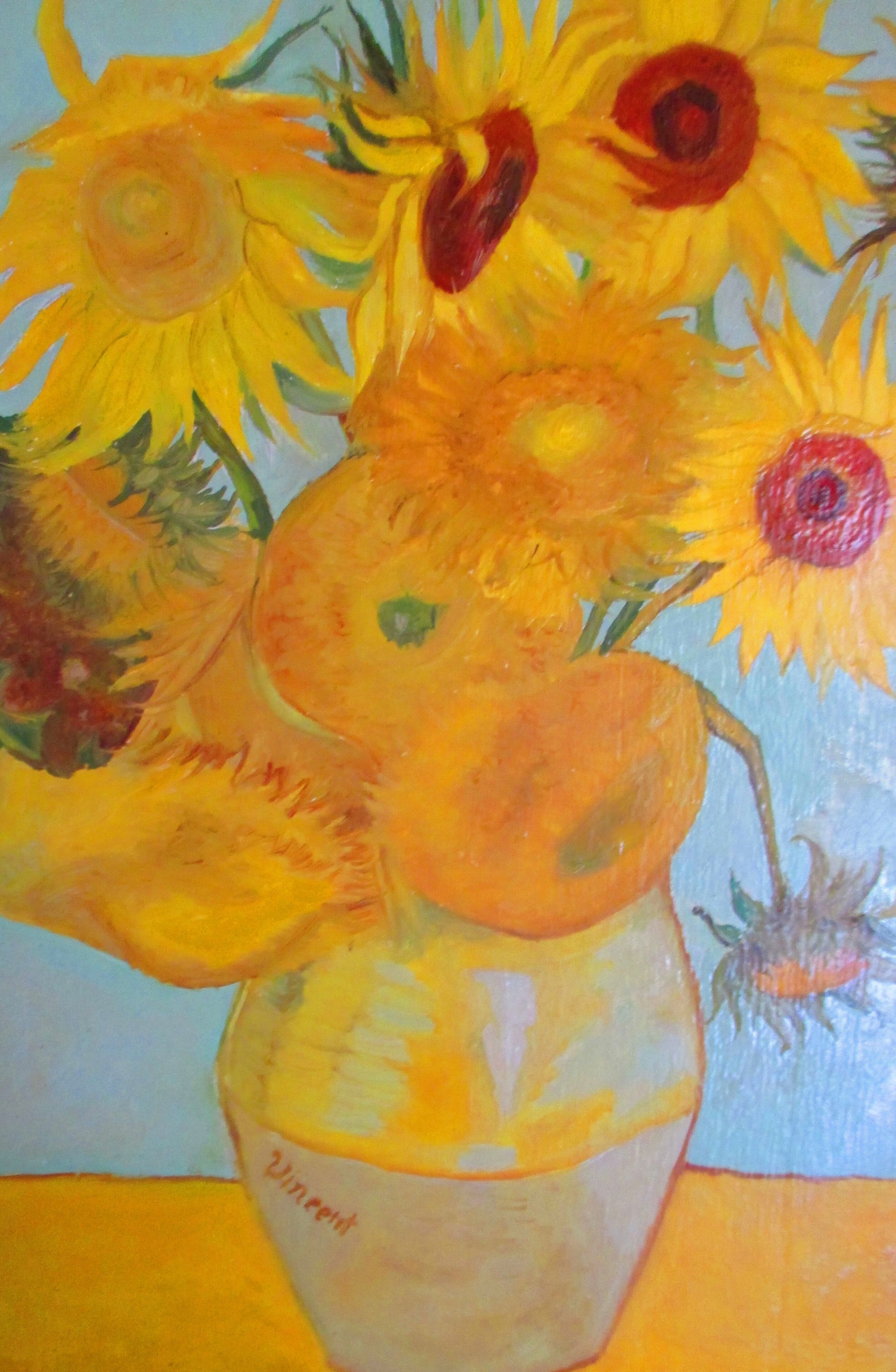A painting of sunflowers in a vase.