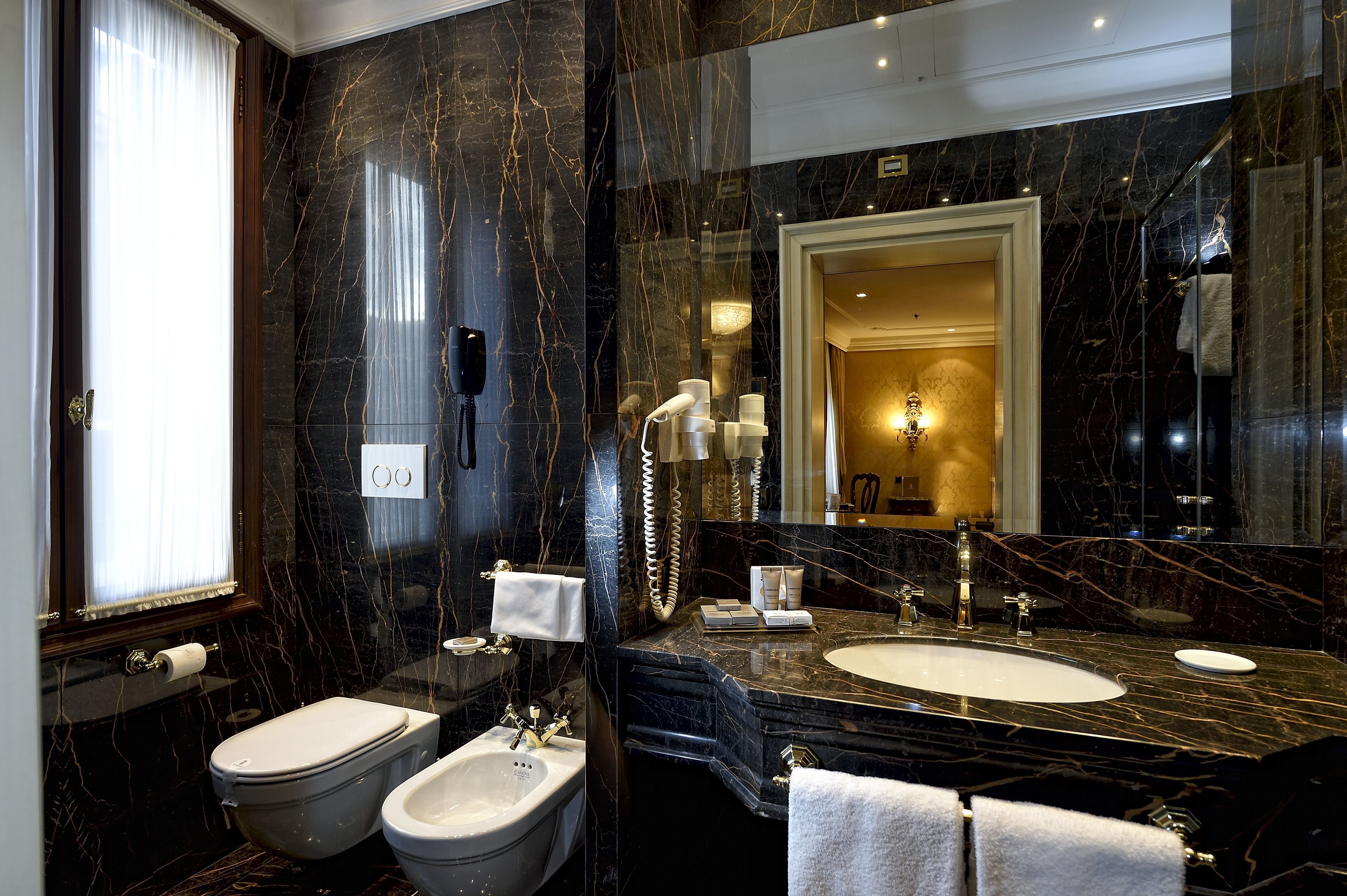 deluxe room | bathroom | free toiletries, hair dryer, slippers, bidet