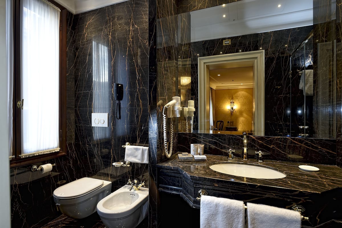 deluxe room | bathroom | free toiletries, hair dryer, slippers, bidet
