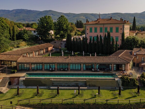 Seasonal outdoor pool, open 10:00 AM to 6:00 PM, pool umbrellas