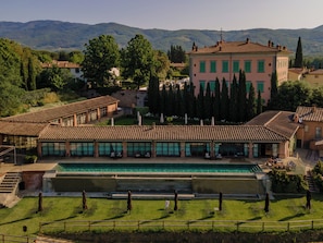 Seasonal outdoor pool, open 10:00 AM to 6:00 PM, pool umbrellas