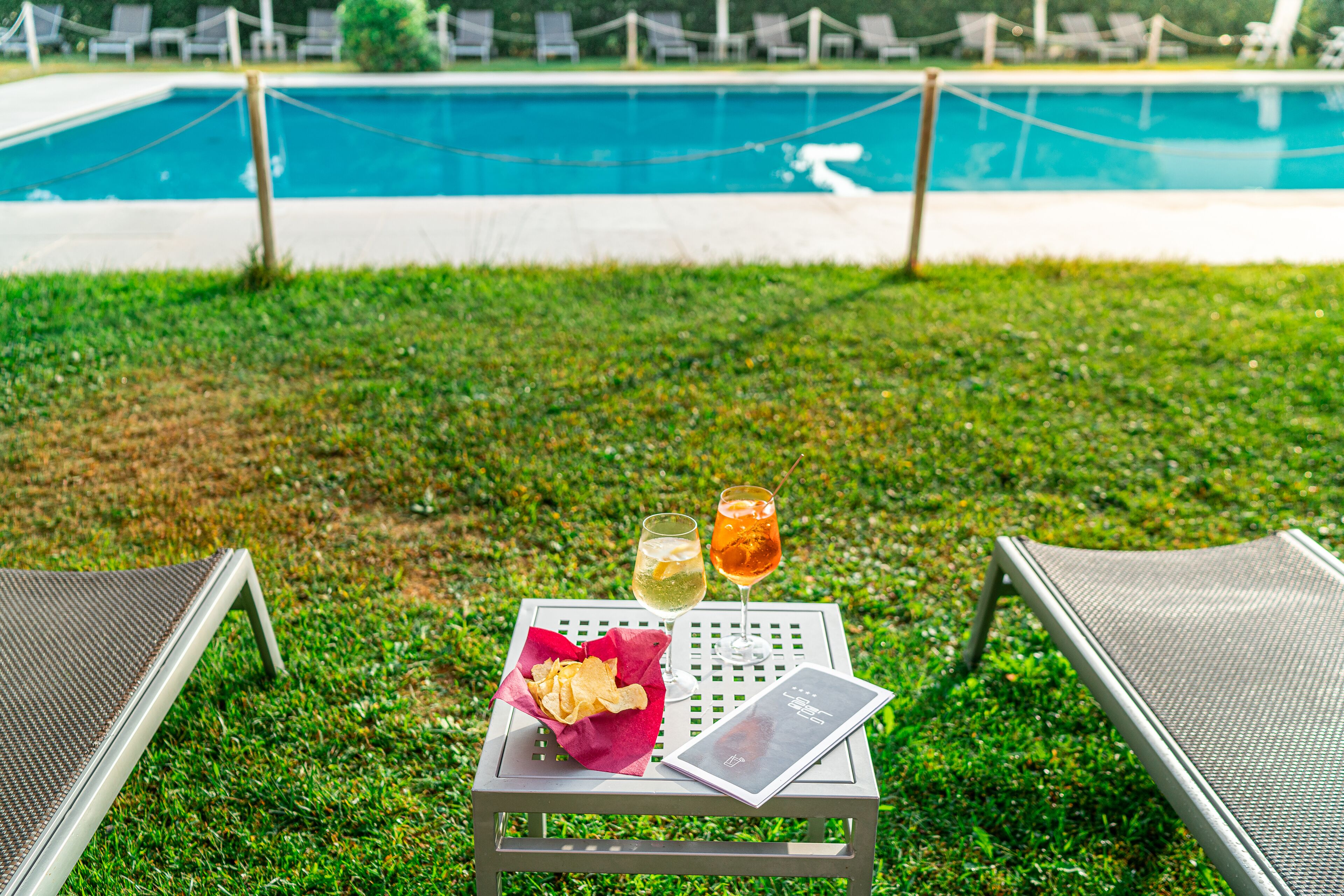 seasonal outdoor pool, open 9 am to 7:30 pm, pool umbrellas