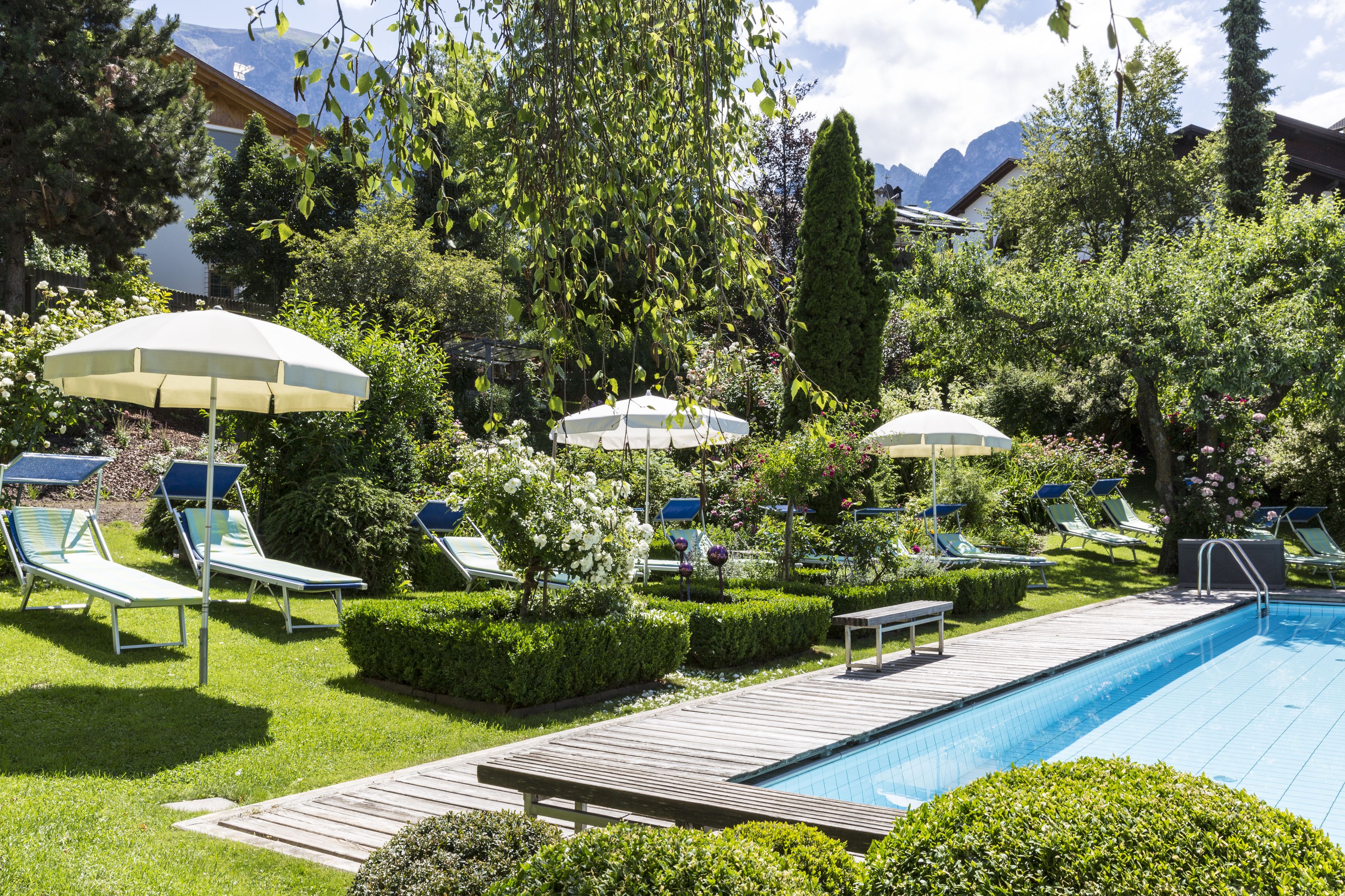 Indoor pool, seasonal outdoor pool, open 7 AM to 8 PM, pool umbrellas