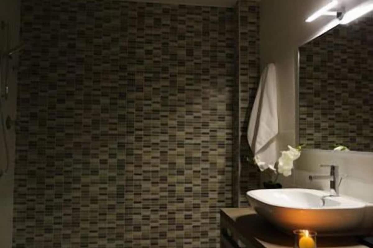 Bathroom | Rainfall showerhead, designer toiletries, hair dryer, bidet