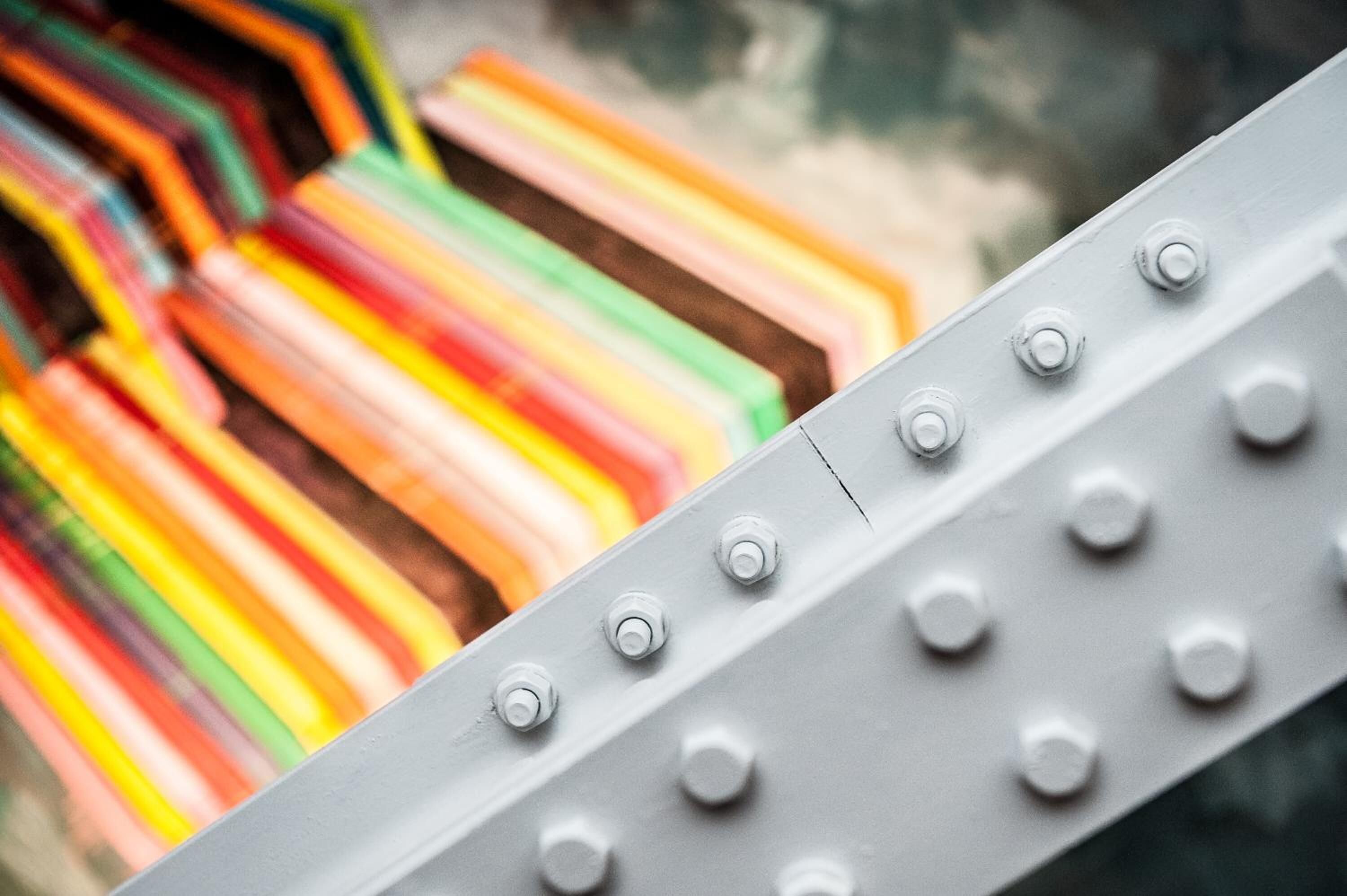 A close-up of a metallic surface with multiple rivets.