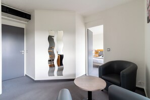 Deluxe Double Room | Living area | 50-cm flat-screen TV with satellite channels, TV - Abor Hôtel (Saint-Pierre-du-Mont)