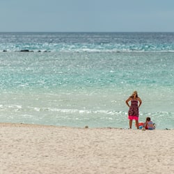 On the beach, white sand, free beach cabanas, sun-loungers