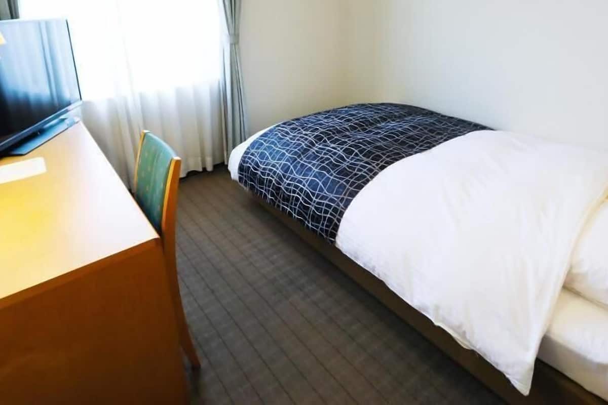 Desk, laptop workspace, blackout curtains, free WiFi