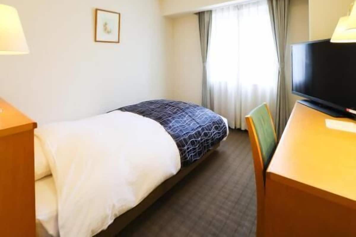 Desk, laptop workspace, blackout curtains, free WiFi