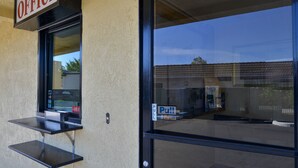 An office building with a sign labeled "OFFICE" above a window. - Rodeway Inn (Sacramento)