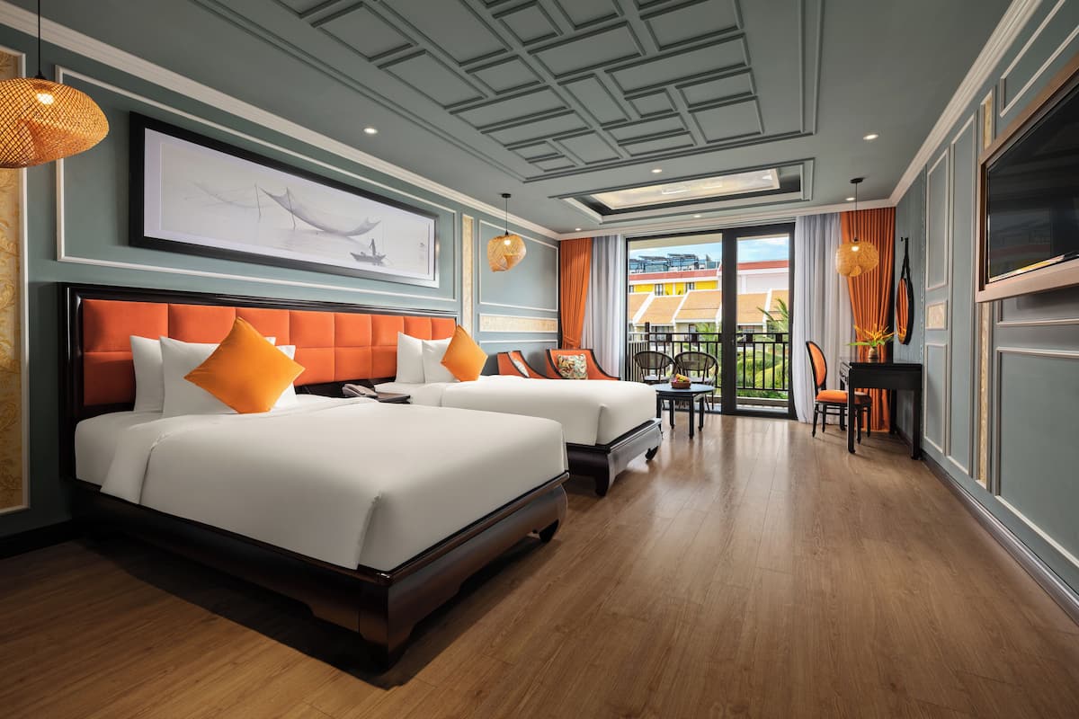 Deluxe Room, Pool View | Down duvets, minibar, in-room safe, desk
