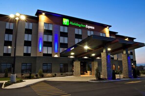 A Holiday Inn Express hotel with a modern facade, large windows, and a covered entrance area. - Holiday Inn Express Pembroke by IHG (Pembroke)