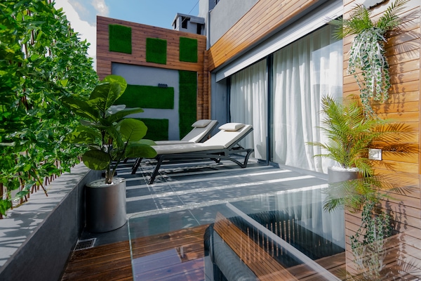 Presidential Suite, 1 King Bed | Living area | 44-inch flat-screen TV with satellite channels, TV