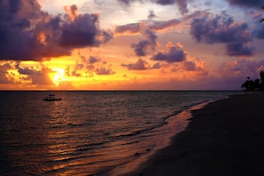 On the beach, white sand, free beach cabanas, sun-loungers