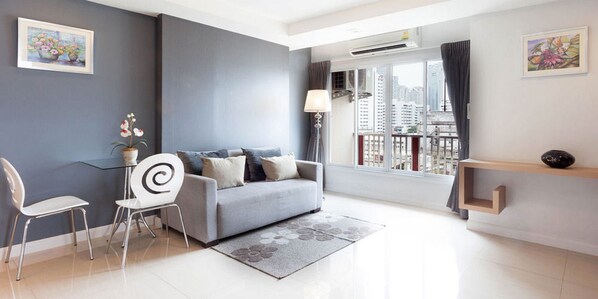 Studio Suite, 1 Bedroom, Balcony | Living area | 32-inch LCD TV with cable channels, TV